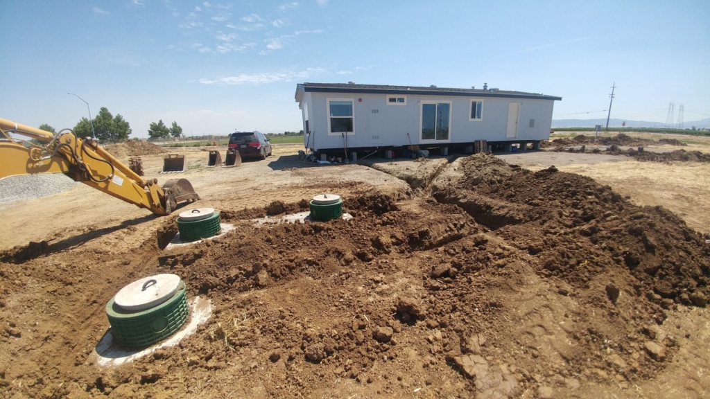 septic tanks backfilled with a compression wheel in frame