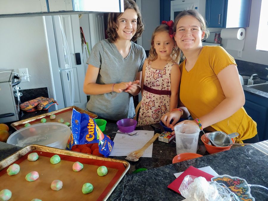3 girls making cookies