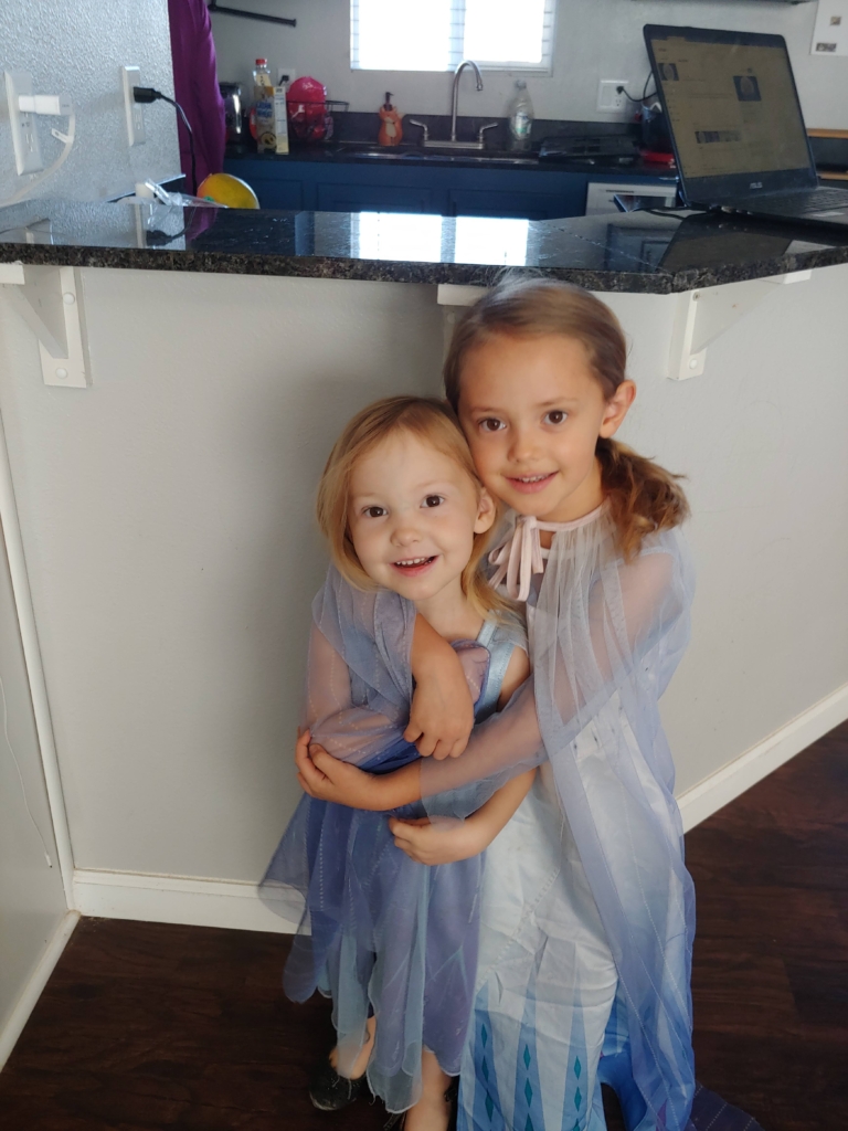 two little girls dressed up as Elsa